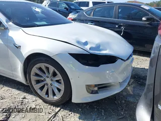 2016 Tesla Model S 70 with VIN 5YJSA1E16GF164264, listed as a IAAI auction lot 40976293 with 68,940 mi miles and . Bid and sale history available at DreamBid. Image 6.