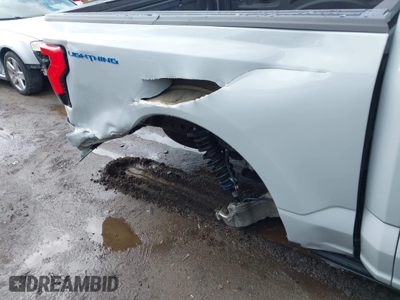2023 Ford F-150 Lightning Pro with VIN 1FTVW1EV3PWG60491, listed as a IAAI auction lot 41507485 with 19,148 mi miles and . Bid and sale history available at DreamBid. Image 20.