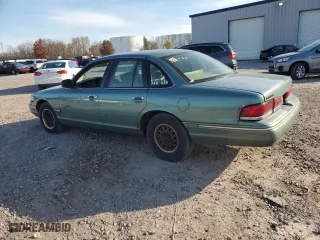 1997 Ford Crown Victoria with VIN 2FALP73W6VX173232, listed as a Copart auction lot 77805094 with 228,871 mi miles and Salvage Title. Bid and sale history available at carsss.com. Image 2.