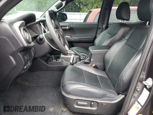 2020 Toyota Tacoma SR5 with VIN 3TMDZ5BN2LM097782, listed as a Copart auction lot 61573465 with 57,321 mi miles and Salvage title. Bid and sale history available at DreamBid. Image 7.