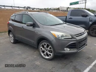 2013 Ford Escape Titanium with VIN 1FMCU0J95DUC71130, listed as a IAAI auction lot 42072032 with 144,054 mi miles and . Bid and sale history available at carsss.com. Image 1.