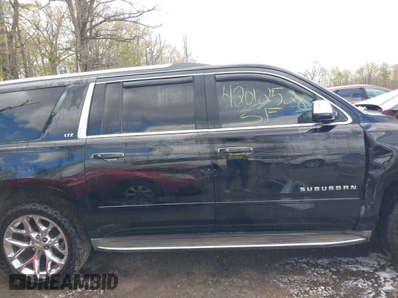 2015 Chevrolet Suburban LTZ with VIN 1GNSKKKC5FR255373, listed as a IAAI auction lot 42012528 with 219,030 mi miles and . Bid and sale history available at DreamBid. Image 13.