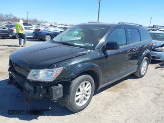 2016 Dodge Journey SXT with VIN 3C4PDCBGXGT123087, listed as a IAAI auction lot 41869667 with 256,583 mi miles. Bid and sale history available at carsss.com. Image 2.