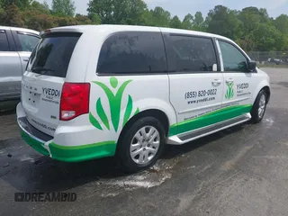 2014 Dodge Grand Caravan American Value with VIN 2C4RDGBG6ER380568, listed as a IAAI auction lot 41683180 with 303,612 mi miles and . Bid and sale history available at DreamBid. Image 4.