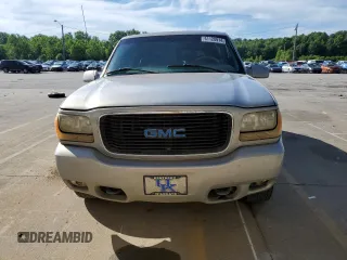1999 GMC Denali z VIN 1GKEK13R0XR916686, wystawiony jako Copart lot #61120914 z przebiegiem 240 605 mil mil oraz Szkody całkowita. Historia ofert i sprzedaży dostępna na DreamBid. Obrazek 5.