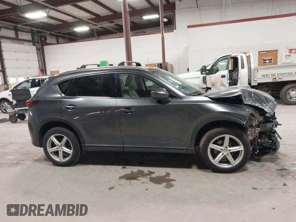 2020 Mazda CX-5 Grand Touring with VIN JM3KFBDM3L0739763, listed as a IAAI auction lot 41751250 with 88,063 mi miles and . Bid and sale history available at carsss.com. Image 13.