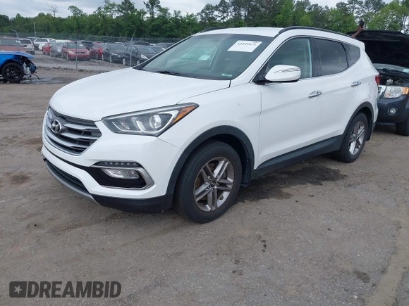 2018 Hyundai Santa Fe 2.4L z VIN 5XYZUDLB1JG543837, wystawiony jako IAAI lot #42235471 z przebiegiem 157 909 mil mil oraz . Historia ofert i sprzedaży dostępna na DreamBid. Obrazek 2.