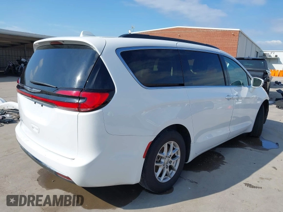 2022 Chrysler Pacifica Touring L with VIN 2C4RC1BG8NR197706, listed as a IAAI auction lot 42414290 with 56,972 mi miles and . Bid and sale history available at DreamBid. Image 4.
