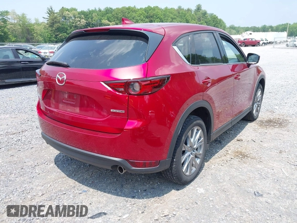 2021 Mazda CX-5 Grand Touring with VIN JM3KFBDM3M0434569, listed as a IAAI auction lot 42422349 with 25,924 mi miles and . Bid and sale history available at DreamBid. Image 4.
