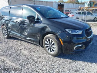 2023 Chrysler Pacifica Hybrid Touring L with VIN 2C4RC1L79PR592477, listed as a IAAI auction lot 40823333 with 8,729 mi miles. Bid and sale history available at carsss.com. Image 1.