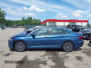 2021 Volkswagen Jetta S z VIN 3VWC57BU6MM046066, wystawiony jako IAAI lot #42199064 z przebiegiem 86 394 mil mil oraz . Historia ofert i sprzedaży dostępna na DreamBid. Obrazek 14.