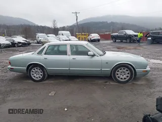 1998 Jaguar XJ with VIN SAJHN1242WC819689, listed as a IAAI auction lot 41148530 with 60,143 mi miles and . Bid and sale history available at DreamBid. Image 13.