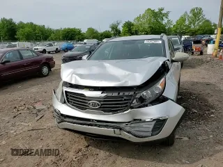 2012 Kia Sportage LX z VIN KNDPB3A29C7264856, wystawiony jako Copart lot #58397685 z przebiegiem 144 621 mil mil oraz Szkoda całkowita • Salvage title. Historia ofert i sprzedaży dostępna na DreamBid. Obrazek 14.
