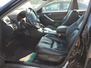 2006 Infiniti G35 z VIN JNKCV51FX6M617002, wystawiony jako Copart lot #51064345 z przebiegiem Nie podano mil oraz Szkody całkowita. Historia ofert i sprzedaży dostępna na DreamBid. Obrazek 7.