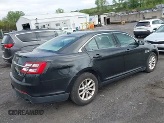 2014 Ford Taurus SE z VIN 1FAHP2D87EG165025, wystawiony jako IAAI lot #42226401 z przebiegiem 209 411 mil mil oraz . Historia ofert i sprzedaży dostępna na DreamBid. Obrazek 4.