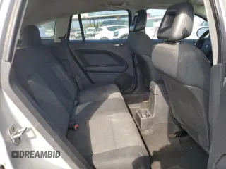 2009 Dodge Caliber SXT with VIN 1B3HB48AX9D157186, listed as a Copart auction lot 52892065 with 218,024 mi miles and Salvage Title. Bid and sale history available at carsss.com. Image 11.