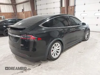 2019 Tesla Model X P90D with VIN 5YJXCAE4XKF180356, listed as a IAAI auction lot 42087926 with 79,041 mi miles. Bid and sale history available at carsss.com. Image 4.