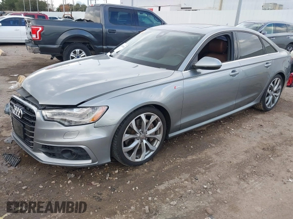 2013 Audi A6 3.0T Prestige with VIN WAUHGAFC3DN131239, listed as a IAAI auction lot 41168869 with 134,628 mi miles. Bid and sale history available at carsss.com. Image 2.