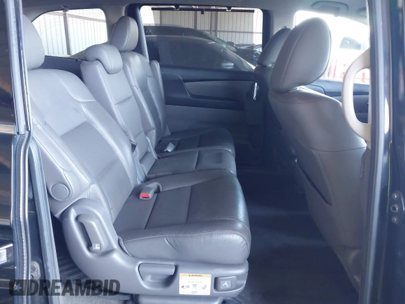 2014 Honda Odyssey Touring with VIN 5FNRL5H94EB110590, listed as a IAAI auction lot 42092929 with 242,338 mi miles and . Bid and sale history available at DreamBid. Image 8.