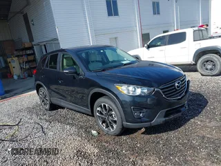 2016 Mazda CX-5 Grand Touring z VIN JM3KE4DY0G0732924, wystawiony jako IAAI lot #42135913 z przebiegiem 126 233 mil mil oraz . Historia ofert i sprzedaży dostępna na DreamBid. Obrazek 1.