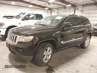 2012 Jeep Grand Cherokee Laredo with VIN 1C4RJFAG6CC266144, listed as a IAAI auction lot 41497163 with 233,755 mi miles. Bid and sale history available at carsss.com. Image 2.