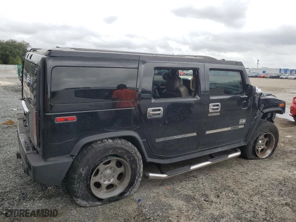 2003 Hummer H2 with VIN 5GRGN23UX3H121939, listed as a Copart auction lot 69503424 with 170,144 mi miles and Salvage Title. Bid and sale history available at carsss.com. Image 3.