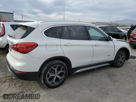 2018 BMW X1 sDrive28i with VIN WBXHU7C37J5H44386, listed as a Copart auction lot 42167135 with 96,668 mi miles and Salvage Title. Bid and sale history available at DreamBid. Image 3.