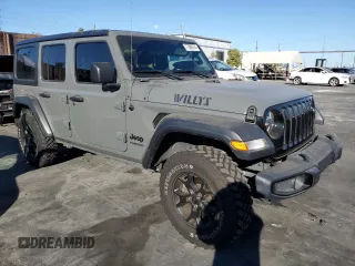 2020 Jeep Wrangler Unlimited Willys with VIN 1C4HJXDG5LW348507, listed as a Copart auction lot 77000574 with 57,056 mi miles and Salvage title. Bid and sale history available at DreamBid. Image 4.