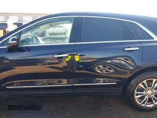 2021 Cadillac XT5 FWD Premium Luxury z VIN 1GYKNCRS2MZ141440, wystawiony jako IAAI lot #41874409 z przebiegiem 76 911 mil mil oraz . Historia ofert i sprzedaży dostępna na DreamBid. Obrazek 14.