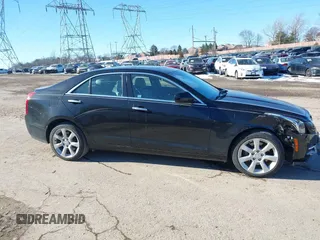 2016 Cadillac ATS Standard AWD z VIN 1G6AG5RX5G0103585, wystawiony jako IAAI lot #41439995 z przebiegiem 58 615 mil mil oraz . Historia ofert i sprzedaży dostępna na DreamBid. Obrazek 14.