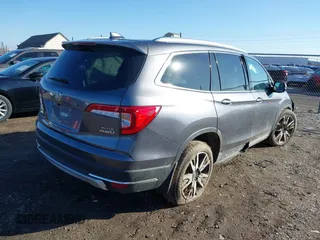 2021 Honda Pilot Elite with VIN 5FNYF6H09MB032350, listed as a IAAI auction lot 41514472 with 45,008 mi miles. Bid and sale history available at carsss.com. Image 4.