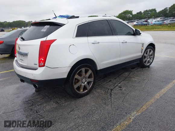 2012 Cadillac SRX Performance Collection with VIN 3GYFNEE33CS528697, listed as a IAAI auction lot 41374060 with 157,319 mi miles and . Bid and sale history available at DreamBid. Image 4.
