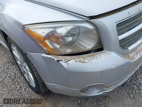 2011 Dodge Caliber Heat with VIN 1B3CB5HA0BD237473, listed as a IAAI auction lot 41690622 with 205,961 mi miles and . Bid and sale history available at DreamBid. Image 12.