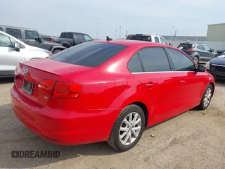 2014 Volkswagen Jetta Sedan SE w/Connectivity with VIN 3VWD07AJ8EM433021, listed as a IAAI auction lot 41695648 with 186,984 mi miles. Bid and sale history available at carsss.com. Image 4.