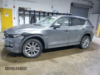 2021 Mazda CX-5 Grand Touring with VIN JM3KFADM5M0428282, listed as a Copart auction lot 42567825 with 33,763 mi miles and Salvage Title. Bid and sale history available at carsss.com. Image 1.