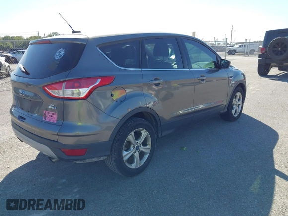 2014 Ford Escape SE with VIN 1FMCU9G97EUD86213, listed as a IAAI auction lot 40515507 with 129,711 mi miles and . Bid and sale history available at carsss.com. Image 4.