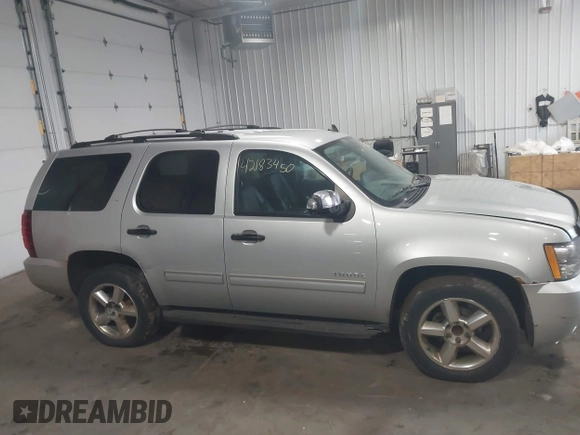 2012 Chevrolet Tahoe LT z VIN 1GNSCBE01CR326465, wystawiony jako IAAI lot #42183450 z przebiegiem 220 129 mil mil oraz . Historia ofert i sprzedaży dostępna na DreamBid. Obrazek 13.