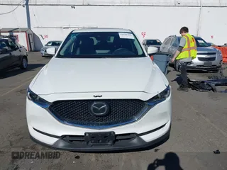2021 Mazda CX-5 Grand Touring with VIN JM3KFBDM6M0483135, listed as a IAAI auction lot 41590430 with 33,466 mi miles. Bid and sale history available at carsss.com. Image 12.