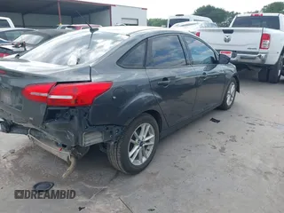 2018 Ford Focus SE with VIN 1FADP3F22JL295342, listed as a IAAI auction lot 42335881 with 77,464 mi miles and . Bid and sale history available at DreamBid. Image 4.
