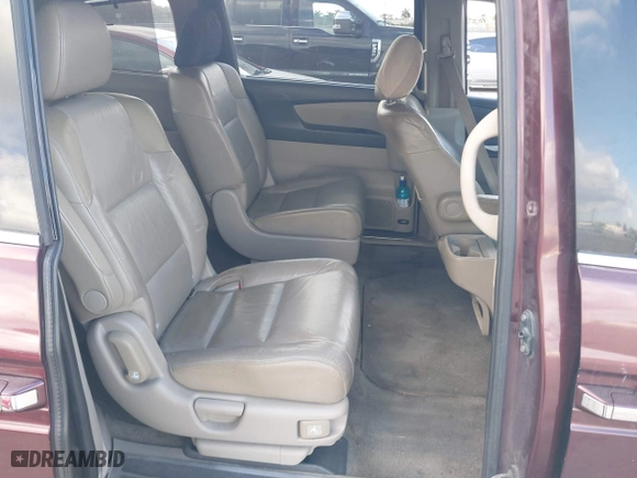 2011 Honda Odyssey Touring with VIN 5FNRL5H97BB008759, listed as a IAAI auction lot 41567010 with 215,709 mi miles. Bid and sale history available at carsss.com. Image 8.