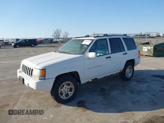 1997 Jeep Grand Cherokee Limited with VIN 1J4GZ78Y8VC769675, listed as a IAAI auction lot 41694347 with 113,834 mi miles. Bid and sale history available at carsss.com. Image 2.
