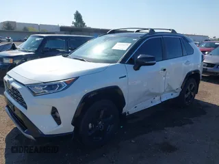 2021 Toyota RAV4 Hybrid XSE with VIN 4T3E6RFV3MU042773, listed as a IAAI auction lot 42000073 with 55,110 mi miles and . Bid and sale history available at DreamBid. Image 2.