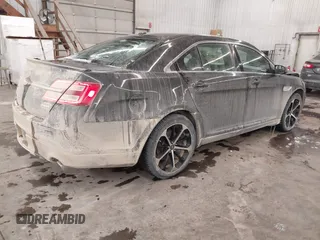 2014 Ford Taurus SEL with VIN 1FAHP2E87EG117653, listed as a IAAI auction lot 41589415 with 125,040 mi miles. Bid and sale history available at carsss.com. Image 4.