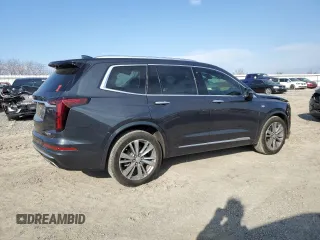2021 Cadillac XT6 Premium Luxury z VIN 1GYKPCRS6MZ205831, wystawiony jako Copart lot #47259215 z przebiegiem 31 959 mil mil oraz Szkody całkowita. Historia ofert i sprzedaży dostępna na DreamBid. Obrazek 3.