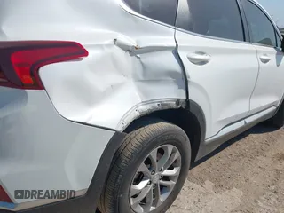 2019 Hyundai Santa Fe SE with VIN 5NMS23AD8KH051223, listed as a IAAI auction lot 42017754 with 146,704 mi miles and . Bid and sale history available at DreamBid. Image 16.