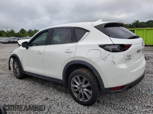 2019 Mazda CX-5 Grand Touring with VIN JM3KFADM6K1581261, listed as a Copart auction lot 59965175 with 127,837 mi miles and Salvage title. Bid and sale history available at DreamBid. Image 2.
