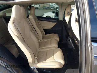 2016 Tesla Model X P90D with VIN 5YJXCAE45GF000773, listed as a IAAI auction lot 42052642 with 127,670 mi miles. Bid and sale history available at carsss.com. Image 8.