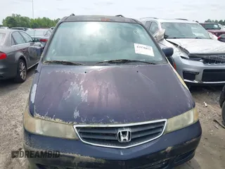 2004 Honda Odyssey EX-RES z VIN 5FNRL18874B132825, wystawiony jako IAAI lot #41978812 z przebiegiem 147 792 mil mil oraz . Historia ofert i sprzedaży dostępna na DreamBid. Obrazek 13.