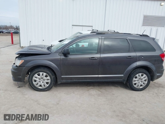 2017 Dodge Journey SE with VIN 3C4PDCABXHT694909, listed as a IAAI auction lot 41640828 with 188,657 mi miles and . Bid and sale history available at DreamBid. Image 14.