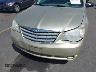 2010 Chrysler Sebring Touring z VIN 1C3CC4FBXAN144734, wystawiony jako IAAI lot #42548485 z przebiegiem 160 588 mil mil oraz . Historia ofert i sprzedaży dostępna na DreamBid. Obrazek 6.